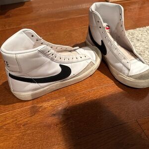 Nike White High-Top Sneakers with Black Swoosh